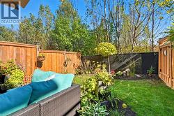 Fenced backyard featuring outdoor lounge area - 