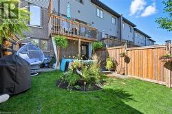 Back of property with brick siding and a balcony - 