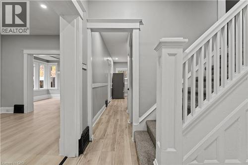 Hallway featuring stairs, light wood-style flooring, recessed lighting, and plenty of natural light - 88 Gage Avenue S, Hamilton, ON - Indoor Photo Showing Other Room