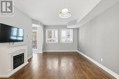 610 - 399 Elizabeth Street, Burlington, ON - Indoor Photo Showing Other Room With Fireplace