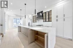 14' long island with additional cabinetry space on rear side of island - 