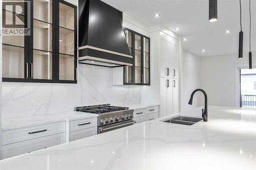 Impressive 36" width gas "commercial style" range - 1417 42 Street Sw, Calgary, AB - Indoor Photo Showing Kitchen With Double Sink With Upgraded Kitchen