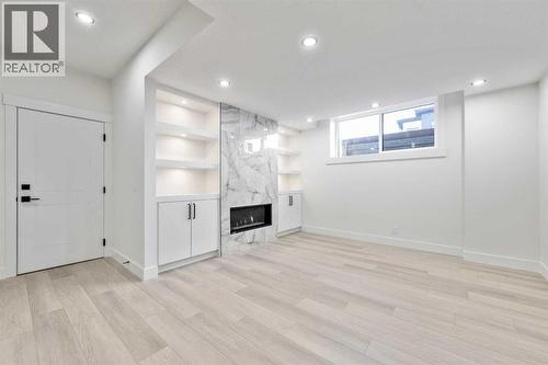 1417 42 Street Sw, Calgary, AB - Indoor Photo Showing Other Room With Fireplace