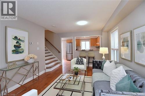 Living room with light wood-style floors and stairs - 2258 Empire Crescent, Burlington, ON - Indoor Photo Showing Living Room