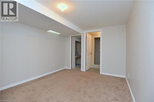 Unfurnished room featuring baseboards and light carpet - 2258 Empire Crescent, Burlington, ON - Indoor Photo Showing Other Room
