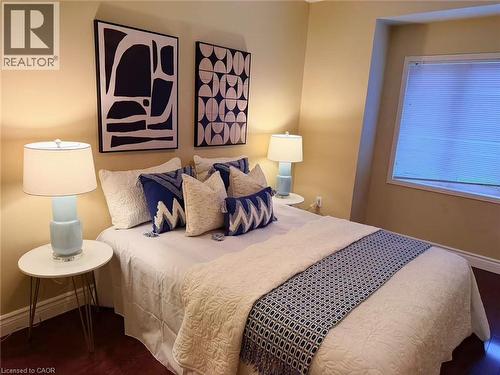 Bedroom with dark wood-style flooring - 2258 Empire Crescent, Burlington, ON - Indoor Photo Showing Bedroom