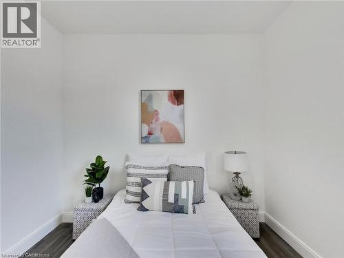 Bedroom featuring baseboards and wood finished floors - 54 Fairview Avenue, Hamilton, ON - Indoor Photo Showing Bedroom