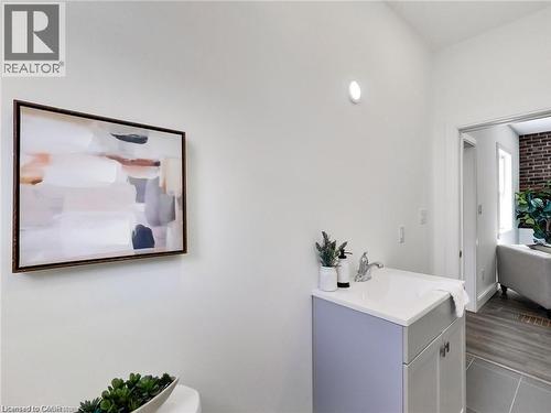 Bathroom with vanity and wood finished floors - 54 Fairview Avenue, Hamilton, ON - Indoor