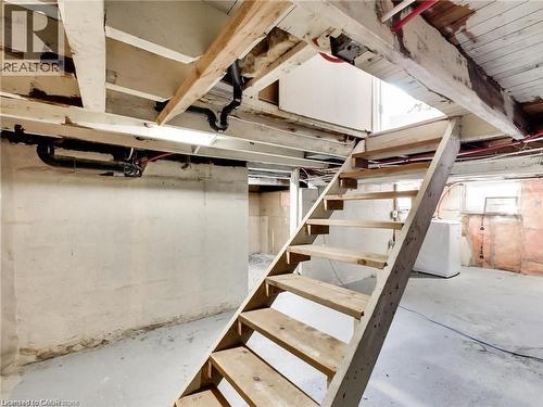 Unfinished basement with washer / dryer and stairway - 54 Fairview Avenue, Hamilton, ON - Indoor