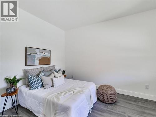 Bedroom with baseboards and wood finished floors - 54 Fairview Avenue, Hamilton, ON - Indoor Photo Showing Bedroom