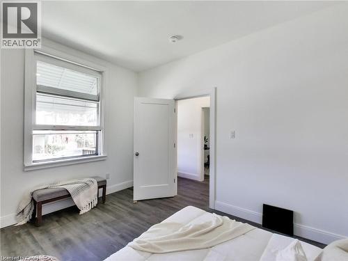 Bedroom featuring baseboards and wood finished floors - 54 Fairview Avenue, Hamilton, ON - Indoor Photo Showing Bedroom