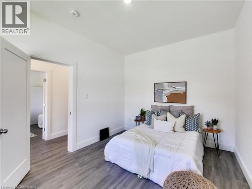 Bedroom featuring baseboards and wood finished floors - 54 Fairview Avenue, Hamilton, ON - Indoor Photo Showing Bedroom
