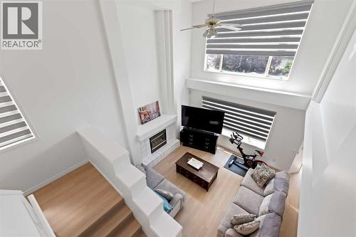 7 Country Hills Park Nw, Calgary, AB - Indoor Photo Showing Other Room With Fireplace