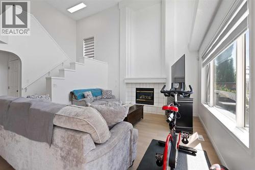 Living Room - 7 Country Hills Park Nw, Calgary, AB - Indoor With Fireplace