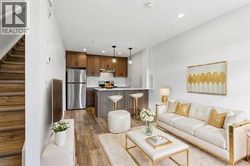 102, 156 Park Street, Cochrane, AB - Indoor Photo Showing Living Room