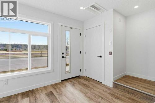 102, 156 Park Street, Cochrane, AB - Indoor Photo Showing Other Room