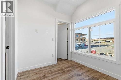 102, 156 Park Street, Cochrane, AB - Indoor Photo Showing Other Room