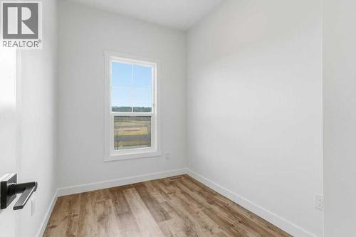 102, 156 Park Street, Cochrane, AB - Indoor Photo Showing Other Room
