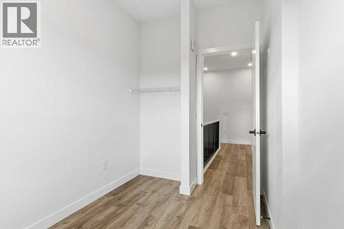 102, 156 Park Street, Cochrane, AB - Indoor Photo Showing Other Room