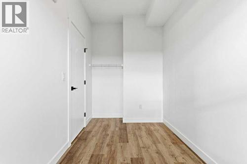 102, 156 Park Street, Cochrane, AB - Indoor Photo Showing Other Room