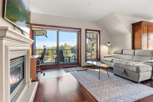 407-2006 Troon Crt, Langford, BC - Indoor Photo Showing Living Room With Fireplace