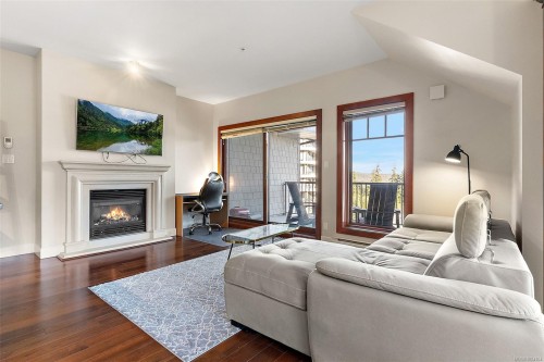 407-2006 Troon Crt, Langford, BC - Indoor Photo Showing Living Room With Fireplace