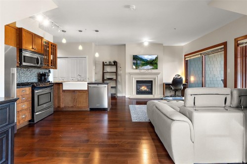 407-2006 Troon Crt, Langford, BC - Indoor Photo Showing Kitchen With Fireplace