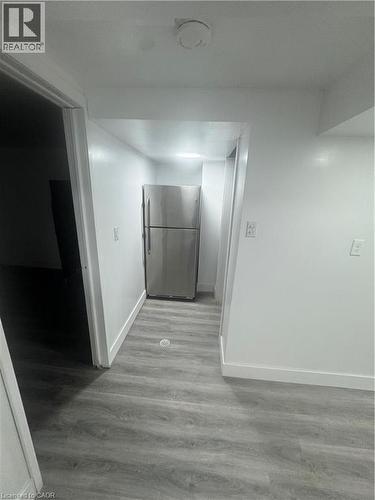 Hall featuring wood finished floors and baseboards - 18 Ingleside Drive, Kitchener, ON - Indoor Photo Showing Other Room