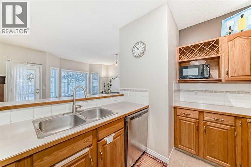 106, 628 56 Avenue Sw, Calgary, AB - Indoor Photo Showing Kitchen With Double Sink