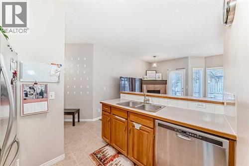 106, 628 56 Avenue Sw, Calgary, AB - Indoor Photo Showing Kitchen With Double Sink