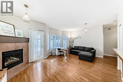 106, 628 56 Avenue Sw, Calgary, AB - Indoor Photo Showing Living Room With Fireplace