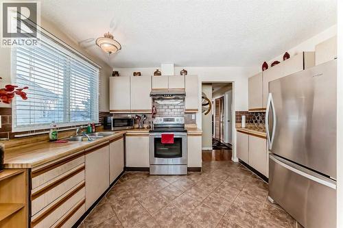 208 Bracewood Road Sw, Calgary, AB - Indoor Photo Showing Kitchen With Stainless Steel Kitchen With Double Sink