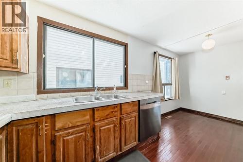 8007 Ranchview Drive Nw, Calgary, AB - Indoor Photo Showing Kitchen With Double Sink