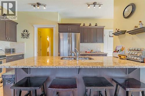 142 West Pointe Circle, Cochrane, AB - Indoor Photo Showing Kitchen With Double Sink With Upgraded Kitchen