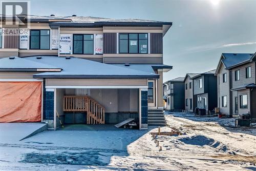 504 Heritage Boulevard, Cochrane, AB - Outdoor With Facade