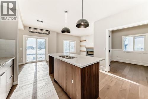 504 Heritage Boulevard, Cochrane, AB - Indoor Photo Showing Kitchen With Double Sink