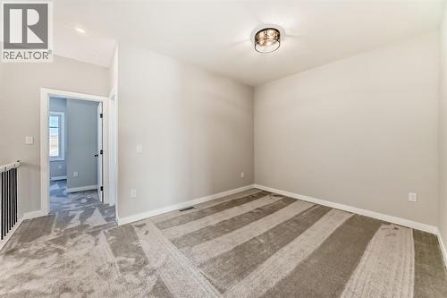 504 Heritage Boulevard, Cochrane, AB - Indoor Photo Showing Other Room