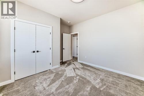 504 Heritage Boulevard, Cochrane, AB - Indoor Photo Showing Other Room