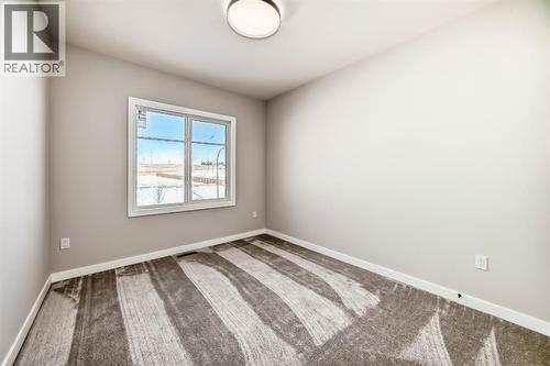 504 Heritage Boulevard, Cochrane, AB - Indoor Photo Showing Other Room