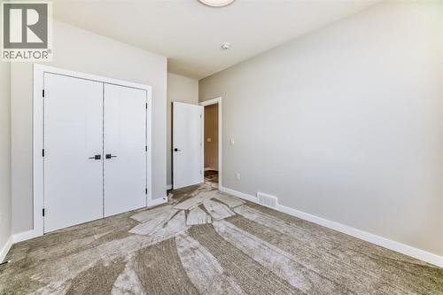 504 Heritage Boulevard, Cochrane, AB - Indoor Photo Showing Other Room