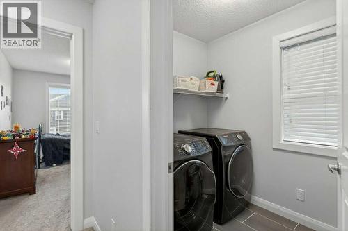 washer Dryer - 139 Evansglen Circle Nw, Calgary, AB - Indoor Photo Showing Laundry Room