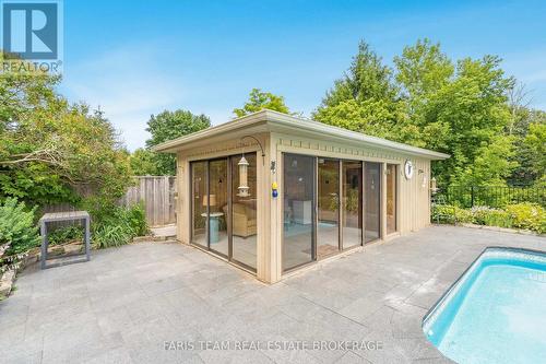 32 Cairns Boulevard, Springwater, ON - Outdoor With In Ground Pool