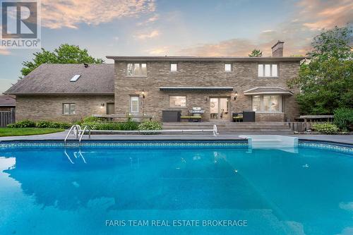 32 Cairns Boulevard, Springwater, ON - Outdoor With In Ground Pool