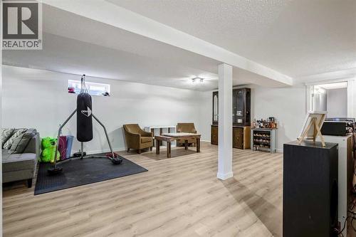 Large Games/Rec Room updated with new laminate flooring and paint 2025 - 830 Westmount Drive, Strathmore, AB - Indoor