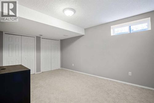 Large 3rd lower bedroom - 830 Westmount Drive, Strathmore, AB - Indoor Photo Showing Other Room