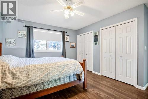 His and hers closets - 830 Westmount Drive, Strathmore, AB - Indoor Photo Showing Bedroom