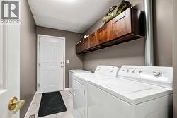 Freshly painted laundry room with access to garage - 