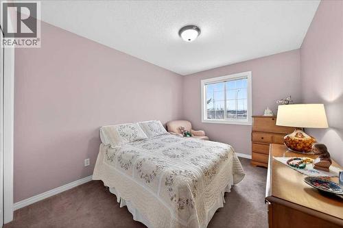 206 Cougarstone Circle Sw, Calgary, AB - Indoor Photo Showing Bedroom