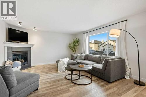 141 Lavender Link, Chestermere, AB - Indoor Photo Showing Living Room With Fireplace