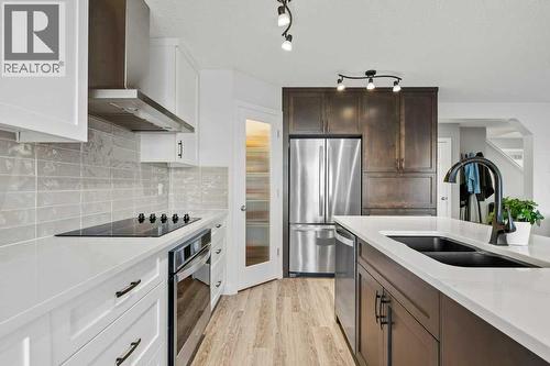 141 Lavender Link, Chestermere, AB - Indoor Photo Showing Kitchen With Double Sink With Upgraded Kitchen